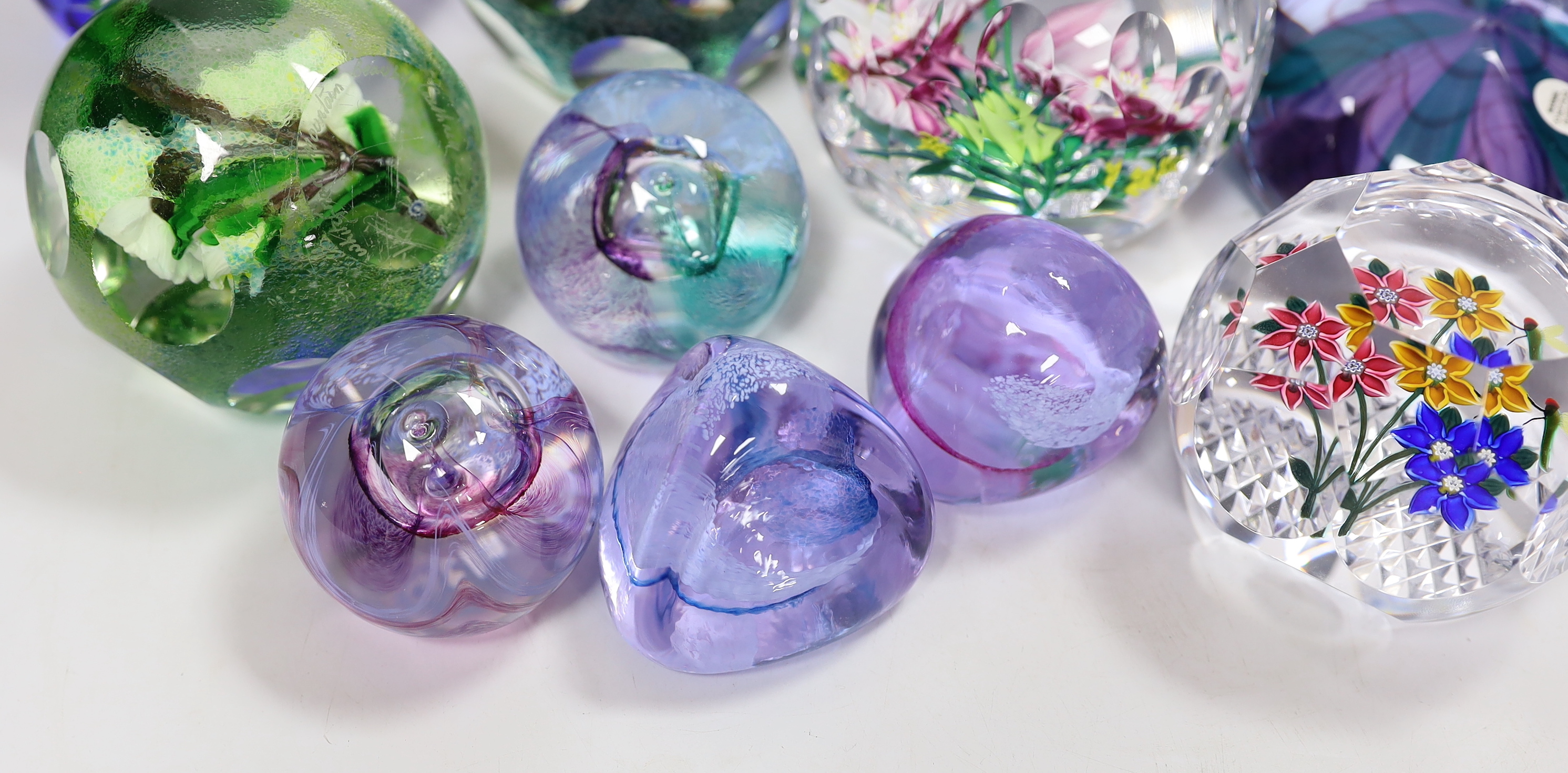 A collection of sixteen modern Caithness glass paperweights with boxes including some limited edition, largest 8cm high